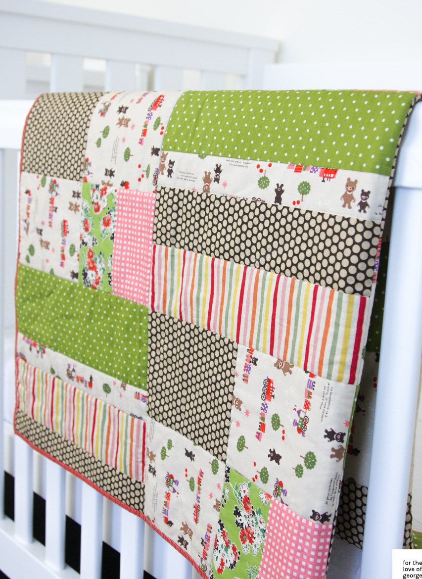 Pink, green, red and brown 'little trains' gender neutral cot quilt on For the Love of George